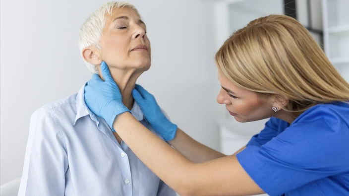 Physiotherapist supervising balance rehabilitation after concussion